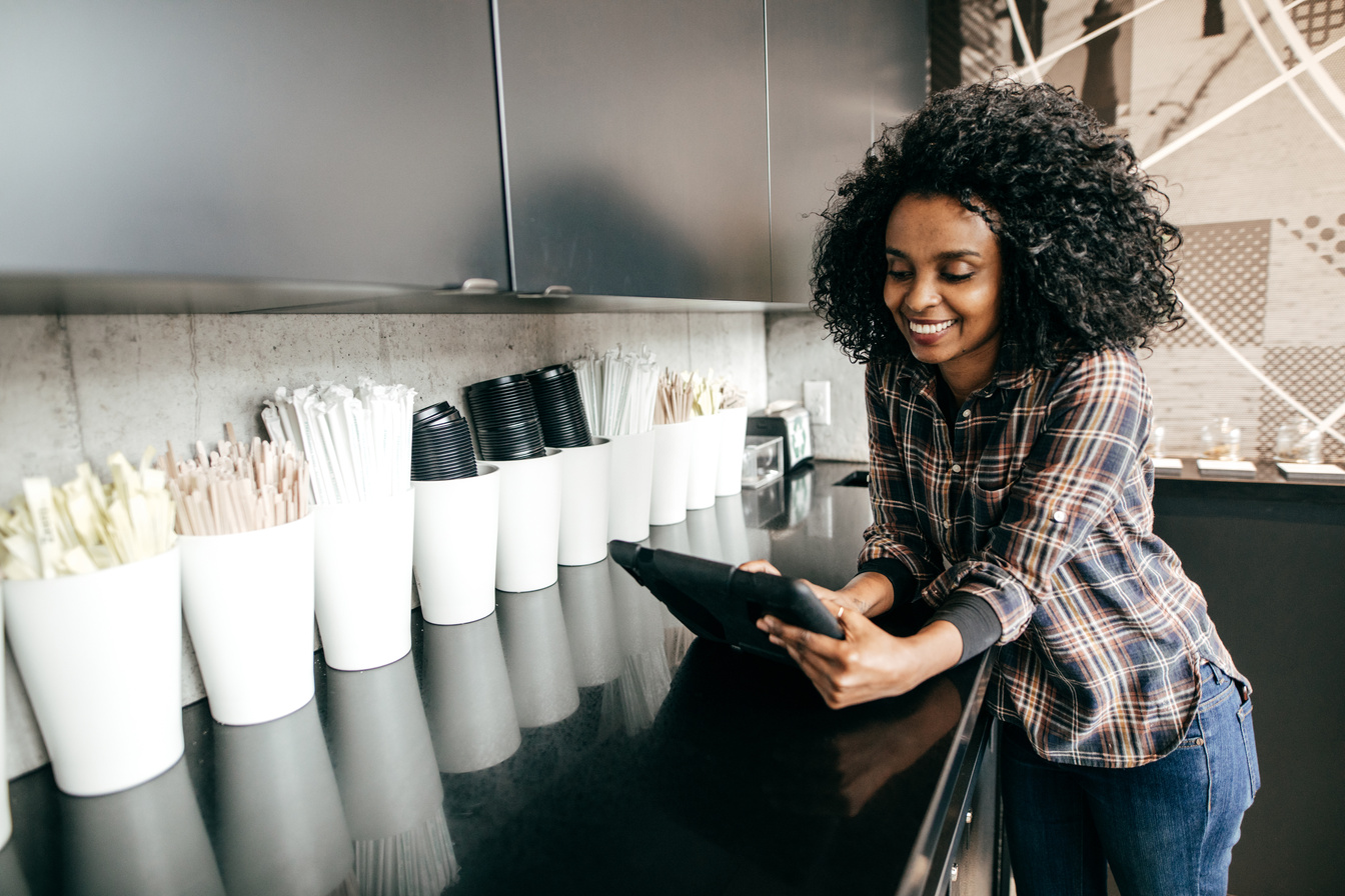 Coffe shop owner with tablet